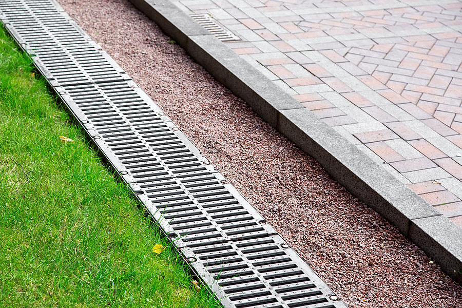 a walkway with side drain